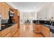 Modern kitchen with stainless steel appliances, wooden cabinets and open to the dining area at 3113 Brians Creek Se Dr, Conyers, GA 30013
