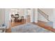 Bright living area with hardwood floors, columns, and staircase at 3113 Brians Creek Se Dr, Conyers, GA 30013