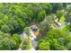 Overhead view of the house surrounded by lush trees, showcasing its serene location and manicured landscaping at 3430 Shorelake Dr, Tucker, GA 30084