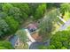Picturesque aerial view of a charming home surrounded by lush trees and a well-maintained yard, ensuring privacy at 3430 Shorelake Dr, Tucker, GA 30084