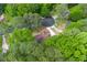 Aerial shot of a home nestled within a leafy neighborhood, surrounded by mature trees at 3430 Shorelake Dr, Tucker, GA 30084
