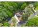 An aerial shot of the house, surrounded by lush greenery and a well-manicured yard in a serene neighborhood at 3430 Shorelake Dr, Tucker, GA 30084