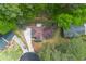 Aerial view of a cozy home with a spacious yard, surrounded by trees and greenery at 3430 Shorelake Dr, Tucker, GA 30084