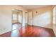 Cozy bedroom with hardwood floors, large window, and mirrored closet doors at 3430 Shorelake Dr, Tucker, GA 30084