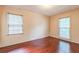 Bedroom with hardwood floors and natural light from two windows at 3430 Shorelake Dr, Tucker, GA 30084