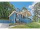 Beautiful blue brick home with a covered porch, situated on a landscaped lot at 3430 Shorelake Dr, Tucker, GA 30084