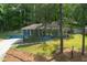 Charming home with a covered porch, set on a sprawling, tree-filled lot at 3430 Shorelake Dr, Tucker, GA 30084