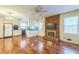 Inviting open concept with wood floors, brick fireplace and views into the kitchen at 3430 Shorelake Dr, Tucker, GA 30084