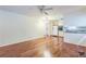 Spacious living area showcasing beautiful wood floors and seamless flow into the adjacent kitchen at 3430 Shorelake Dr, Tucker, GA 30084