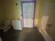This bathroom features a toilet, sink, vanity combination, and a bathtub shower at 39 N Broad St, Covington, GA 30014