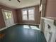 Bedroom featuring natural light and a fireplace with built-ins, creating a cozy atmosphere at 39 N Broad St, Covington, GA 30014