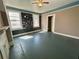 This bedroom offers natural light, original hardwood floors, and a non-operative fireplace with built-in shelves at 39 N Broad St, Covington, GA 30014