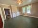 Spacious living room featuring a ceiling fan, fireplace, and plenty of natural light at 39 N Broad St, Covington, GA 30014
