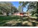 The expansive backyard shows a covered patio and a storage shed in the distance at 4551 Salem Rd, Covington, GA 30016