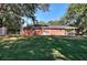 Spacious backyard with a full fence, mature trees, and green grass at 4551 Salem Rd, Covington, GA 30016