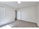 Carpeted bedroom with a closet and open door leading to another room at 4551 Salem Rd, Covington, GA 30016