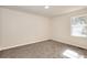 Well-lit carpeted bedroom with a window bringing in natural light at 4551 Salem Rd, Covington, GA 30016
