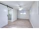 Bright bedroom with ceiling fan, barn door to bathroom, and natural light from the double window at 4551 Salem Rd, Covington, GA 30016