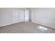 Bedroom with neutral carpet, closet, and natural light coming through the window at 4551 Salem Rd, Covington, GA 30016