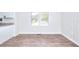 Dining area with modern flooring, wainscotting, and ample natural light from a large window at 4551 Salem Rd, Covington, GA 30016