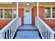 Inviting brick home with a white front door and freshly painted gray steps leading to a cozy, covered porch at 4551 Salem Rd, Covington, GA 30016