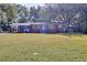 Charming brick home with well-manicured front lawn and mature trees at 4551 Salem Rd, Covington, GA 30016