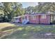 Brick house with white trim and a green lawn in the front yard at 4551 Salem Rd, Covington, GA 30016
