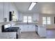 Well-lit kitchen featuring new countertops, appliances, and bright, modern lighting at 4551 Salem Rd, Covington, GA 30016