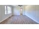 Bright living room boasting vinyl flooring, a ceiling fan, and a picturesque view from the window at 4551 Salem Rd, Covington, GA 30016