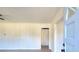 Bright living room featuring wainscotting and a recently installed door frame and neutral-toned flooring at 4551 Salem Rd, Covington, GA 30016