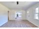 Spacious living room with view of kitchen, modern vinyl flooring, and well-lit with natural light at 4551 Salem Rd, Covington, GA 30016