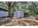 A fenced area in the backyard has a utility shed for storage at 4551 Salem Rd, Covington, GA 30016