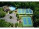 An aerial shot shows the community pool, tennis courts, and clubhouse at 5595 Timson Ln, Johns Creek, GA 30022