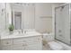 Bathroom featuring a shower with glass enclosure and a white vanity at 5595 Timson Ln, Johns Creek, GA 30022