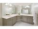 Bathroom with dual sinks, large mirror and white-tiled floor at 5595 Timson Ln, Johns Creek, GA 30022