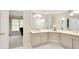 Bathroom with dual sinks, large mirror and white-tiled floor at 5595 Timson Ln, Johns Creek, GA 30022