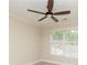 Bedroom features a ceiling fan and neutral decor at 5595 Timson Ln, Johns Creek, GA 30022