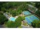 Community amenities featuring sparkling pool, tennis courts, playground, and clubhouse for residents at 5595 Timson Ln, Johns Creek, GA 30022