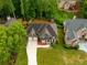 Charming two-story home boasts a well-kept lawn and a convenient two-car garage at 5595 Timson Ln, Johns Creek, GA 30022