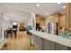Open-concept kitchen with stainless steel appliances and an island at 5595 Timson Ln, Johns Creek, GA 30022