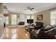 Comfortable living room with hardwood floors, fireplace and large windows at 5595 Timson Ln, Johns Creek, GA 30022