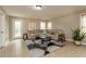 Spacious living room features a sectional sofa and modern decor at 5595 Timson Ln, Johns Creek, GA 30022