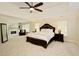 Spacious main bedroom suite with sitting area, fireplace, tray ceiling, and carpeted floor at 5595 Timson Ln, Johns Creek, GA 30022