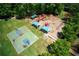 Aerial view of community playground with slides and swings at 5595 Timson Ln, Johns Creek, GA 30022