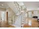Carpeted staircase leading to a landing area and open living space at 5595 Timson Ln, Johns Creek, GA 30022