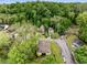 Aerial view showcases the home's location within a neighborhood with mature trees and well-maintained streets at 72 Griggs Sw St, Marietta, GA 30064