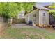 Secluded backyard with a brick patio and a well-maintained fence, creating a private outdoor space at 72 Griggs Sw St, Marietta, GA 30064