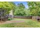 Lush backyard with a screened porch and privacy fence, offering a tranquil and private outdoor retreat at 72 Griggs Sw St, Marietta, GA 30064