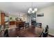 Dining room leading into kitchen with stainless appliances, an island, and views to living area at 72 Griggs Sw St, Marietta, GA 30064