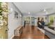 Open concept living room with hardwood floors, gray walls, and an entryway visible in the back of the room at 72 Griggs Sw St, Marietta, GA 30064